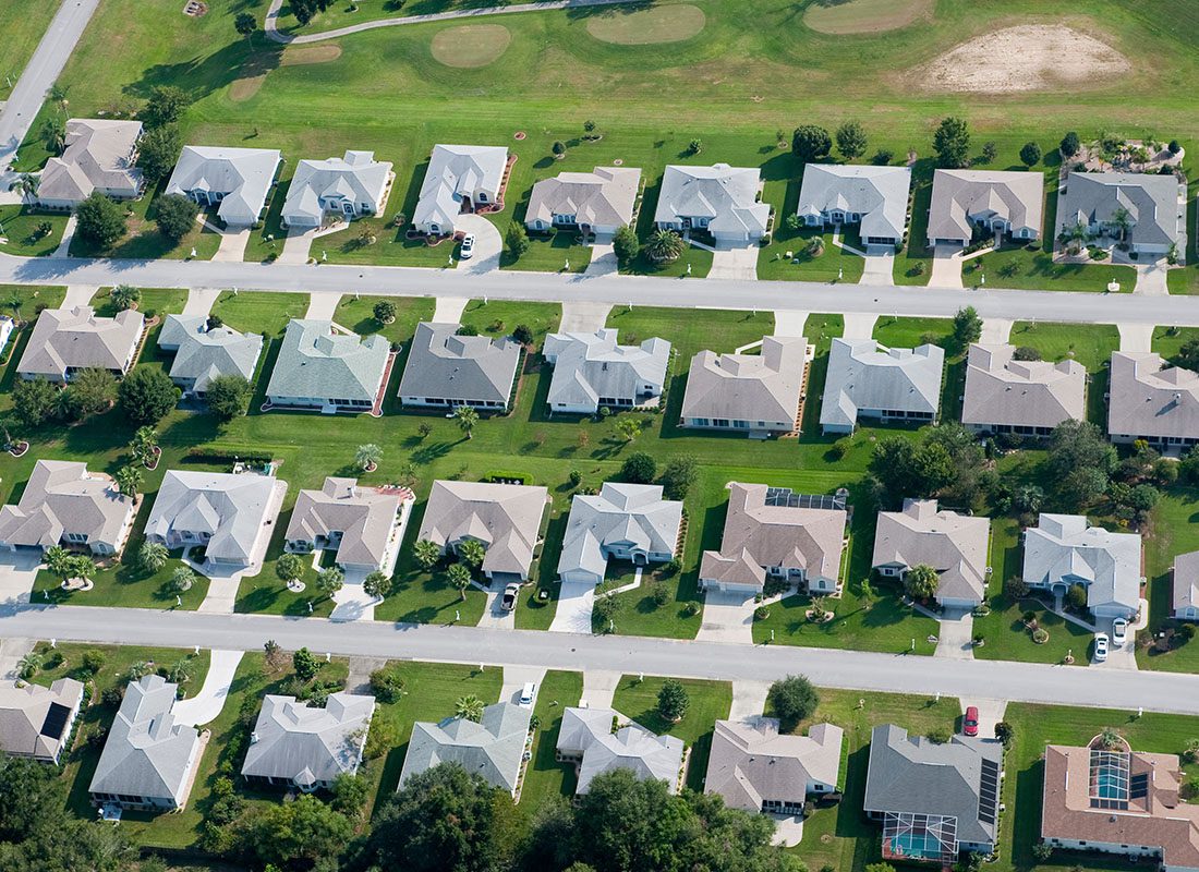Greenwood, IN - Aerial View of a Community of Homes on a Sunny Day