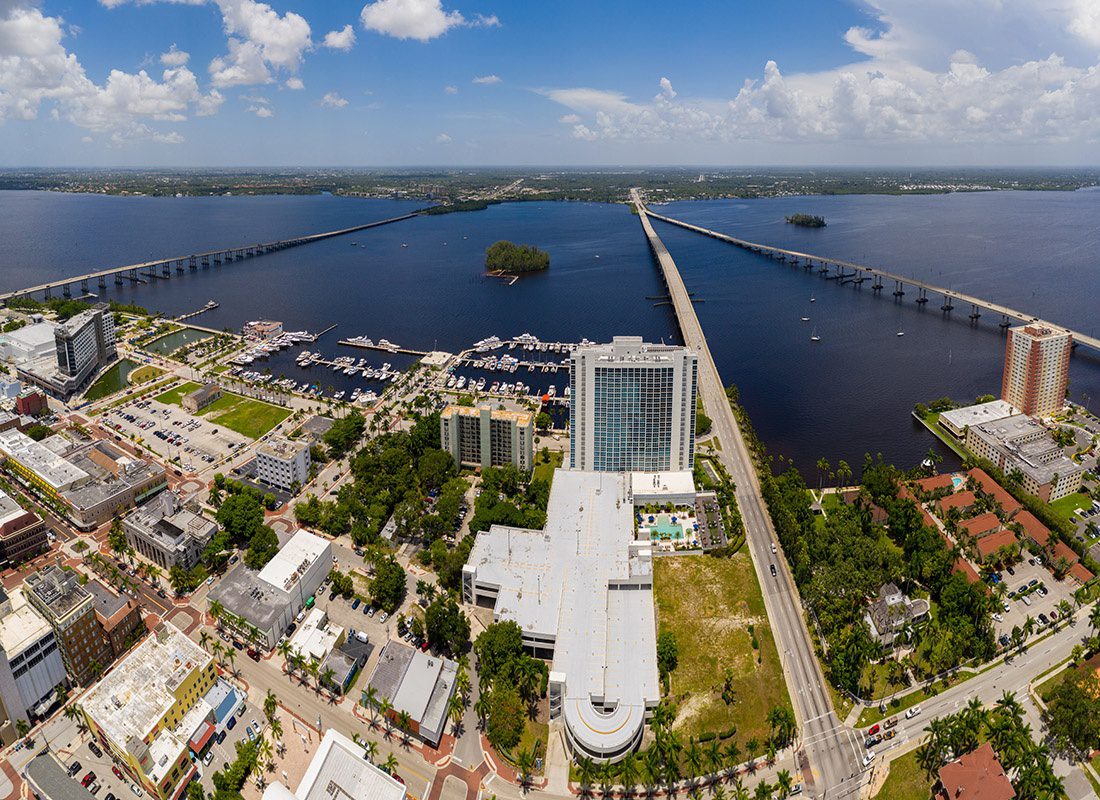 North Fort Myers, FL - Aerial View of Fort Myers, FL With a Bridge Heading to North Fort Myers, FL